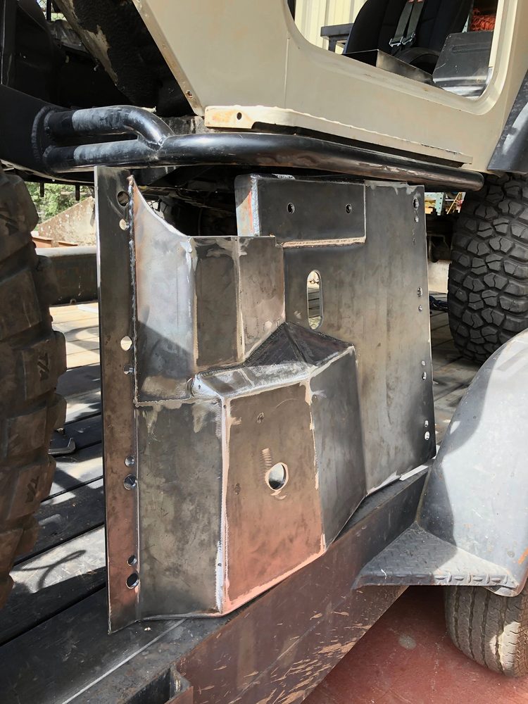 Fabricated steel bracket welded to a vehicle chassis